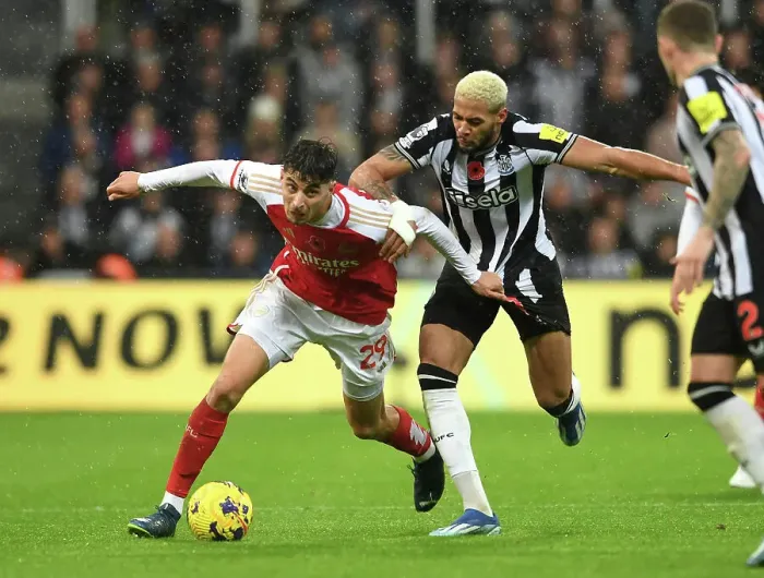 Framed Print : Arsenal's Kai Havertz Faces Off Against Newcastle's Joelinton in Premier League Clash (2023-24)