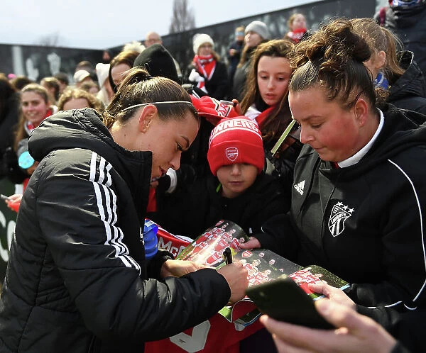 Arsenal's Katie McCabe Celebrates Victory and Greets Fans with Autographs