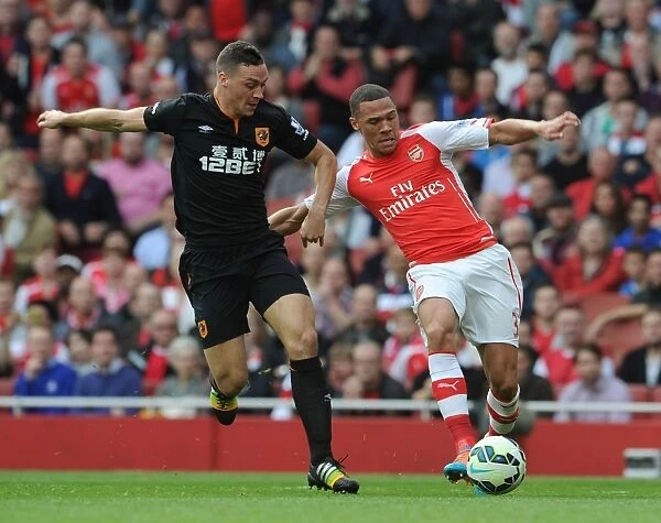 Arsenal's Kieran Gibbs Clashes with Hull City's James Chester in Premier League Showdown