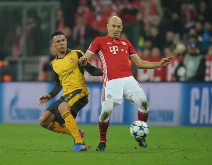 Framed Print : Arsenal's Kieran Gibbs Faces Off Against Bayern Munchen's Arjen Robben in Champions League Clash Framed Print : Arsenal's Kieran Gibbs Faces Off Against Bayern Munchen's Arjen Robben in Champions League Clash