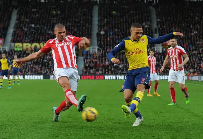 Framed Print : Arsenal's Kieran Gibbs Faces Off Against Stoke City's Jonathan Walters in Premier League Clash