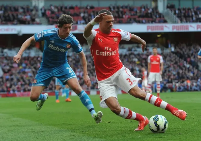 Framed Print : Arsenal's Kieran Gibbs Faces Off Against Sunderland's Billy Jones in Intense Premier League Clash