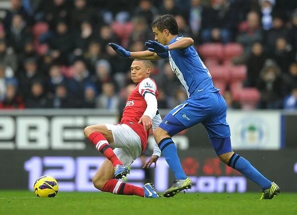 Arsenal's Kieran Gibbs Faces Off Against Wigan's Franco Di Santo in Premier League Clash (2012-13)