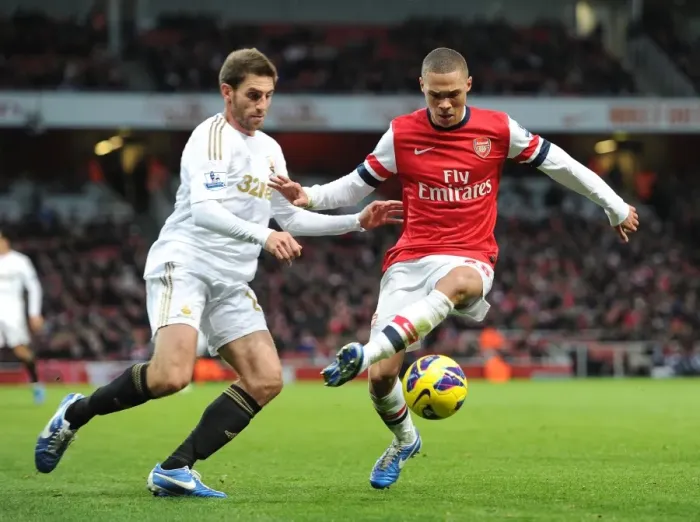 Framed Print : Arsenal's Kieran Gibbs Fends Off Swansea's Angel Rangel in Premier League Clash (2012-13)