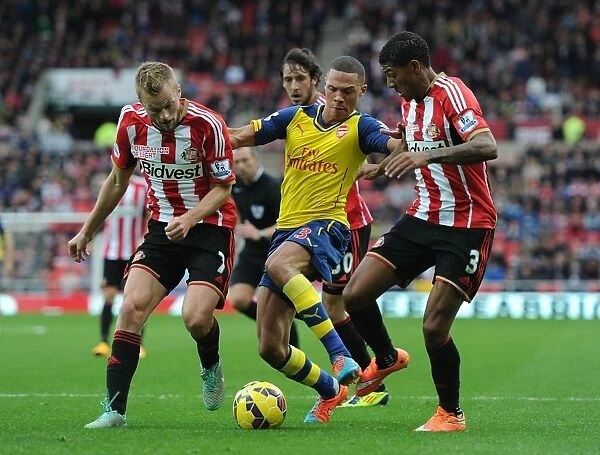 Arsenal's Kieran Gibbs Outmaneuvers Larsson and van Aanholt during Sunderland Clash