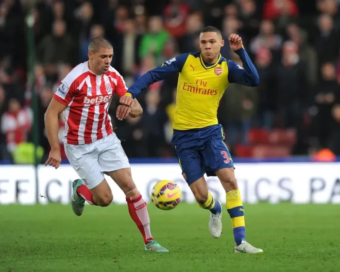 Framed Print : Arsenal's Kieran Gibbs Outmaneuvers Stoke's Jonathan Walters Framed Print : Arsenal's Kieran Gibbs Outmaneuvers Stoke's Jonathan Walters
