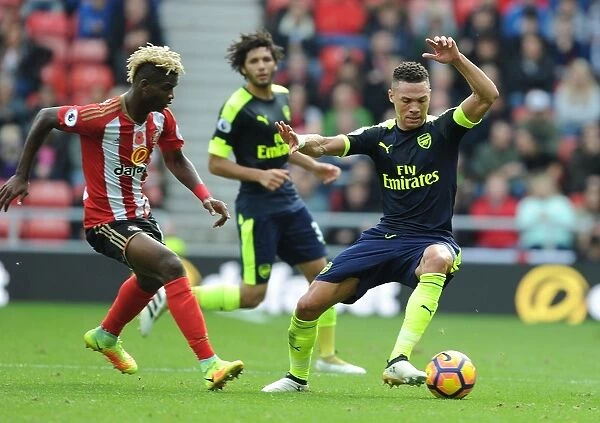 Arsenal's Kieran Gibbs Outpaces Sunderland's Didier Ndong in Premier League Clash (2016-17)