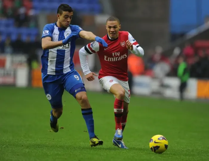 Framed Print : Arsenal's Kieran Gibbs Outruns Wigan's Franco Di Santo during the 2012-13 Premier League Clash Framed Print : Arsenal's Kieran Gibbs Outruns Wigan's Franco Di Santo during the 2012-13 Premier League Clash