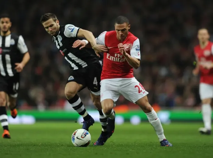 Framed Print : Arsenal's Kieran Gibbs Outsmarts Yohan Cabaye: A Premier League Showdown (2011-12)