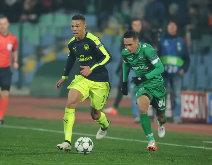 Framed Print : Arsenal's Kieran Gibbs Overpowers Marcelinho in PFC Ludogorets Razgrad vs Arsenal FC UEFA Champions League Clash Framed Print : Arsenal's Kieran Gibbs Overpowers Marcelinho in PFC Ludogorets Razgrad vs Arsenal FC UEFA Champions League Clash