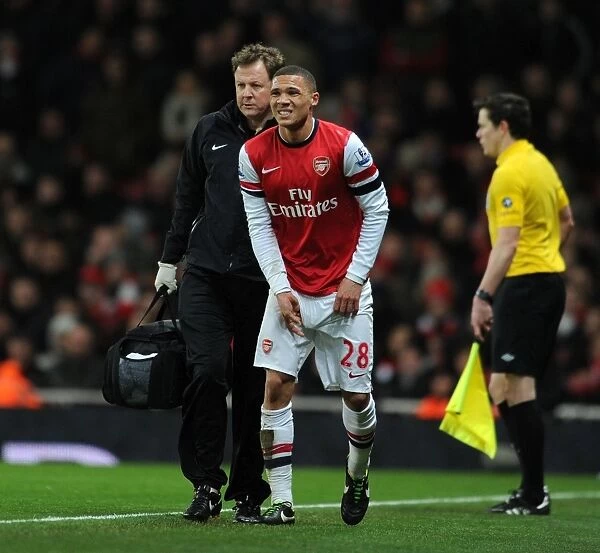 Arsenal's Kieran Gibbs Receives Treatment from Physio Colin Lewin during Arsenal v Liverpool Match