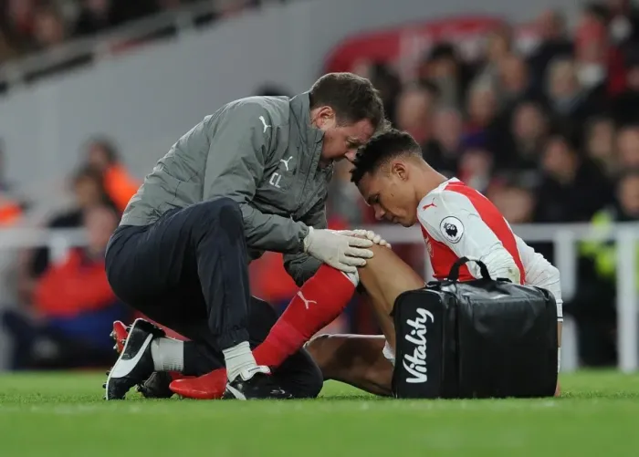 Framed Print : Arsenal's Kieran Gibbs Receives Treatment from Physio Colin Lewin during Arsenal v West Bromwich Albion Match Framed Print : Arsenal's Kieran Gibbs Receives Treatment from Physio Colin Lewin during Arsenal v West Bromwich Albion Match