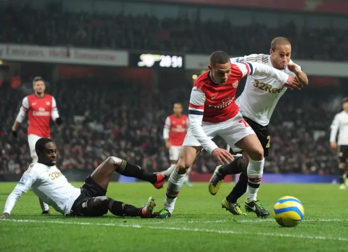 Framed Print : Arsenal's Kieran Gibbs Stands Firm Amid Swansea's Challenge in FA Cup Showdown Framed Print : Arsenal's Kieran Gibbs Stands Firm Amid Swansea's Challenge in FA Cup Showdown