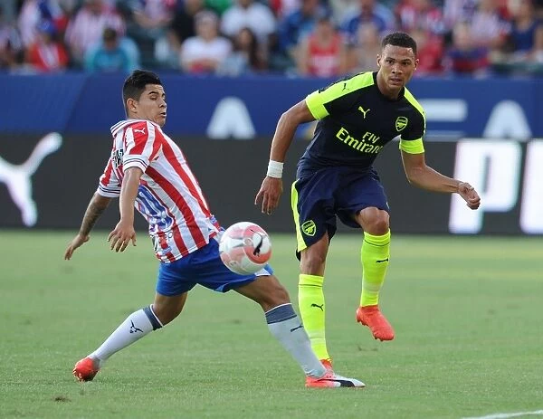 Arsenal's Kieran Gibbs vs Chivas Eduardo Lopez: A Battle on the Soccer Field