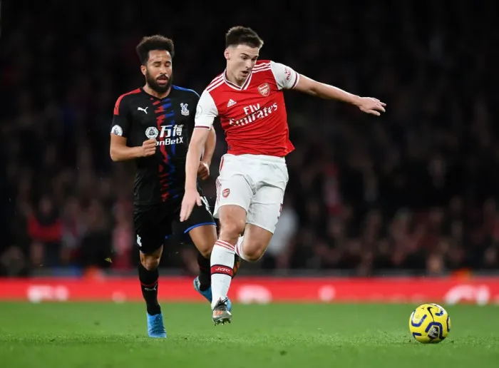Framed Print : Arsenal's Kieran Tierney Clashes with Andros Townsend in the Premier League Showdown between Arsenal and Crystal Palace