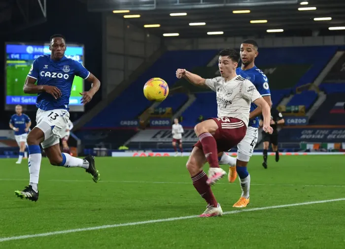 Framed Print : Arsenal's Kieran Tierney Clashes with Everton's Mina and Holgate in Premier League Showdown