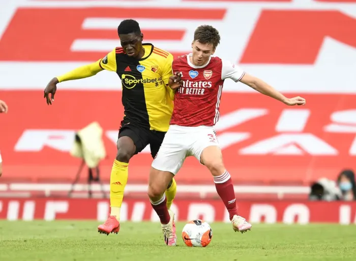 Framed Print : Arsenal's Kieran Tierney Clashes with Ismaila Sarr in Intense Premier League Face-off Framed Print : Arsenal's Kieran Tierney Clashes with Ismaila Sarr in Intense Premier League Face-off