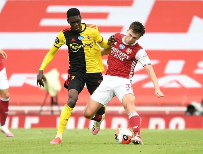 Framed Print : Arsenal's Kieran Tierney Clashes with Ismaila Sarr in Intense Premier League Face-off Framed Print : Arsenal's Kieran Tierney Clashes with Ismaila Sarr in Intense Premier League Face-off