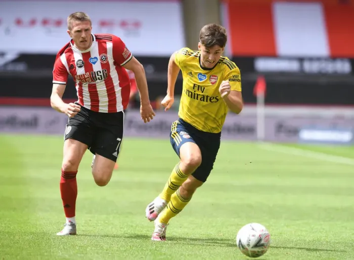Framed Print : Arsenal's Kieran Tierney Clashes with John Lundstram in FA Cup Quarterfinal Battle