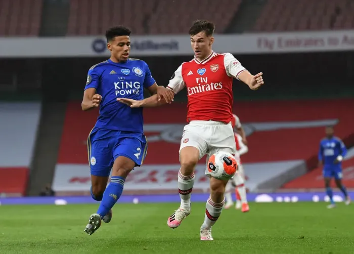 Framed Print : Arsenal's Kieran Tierney Clashes with Leicester's James Justin in Premier League Showdown Framed Print : Arsenal's Kieran Tierney Clashes with Leicester's James Justin in Premier League Showdown