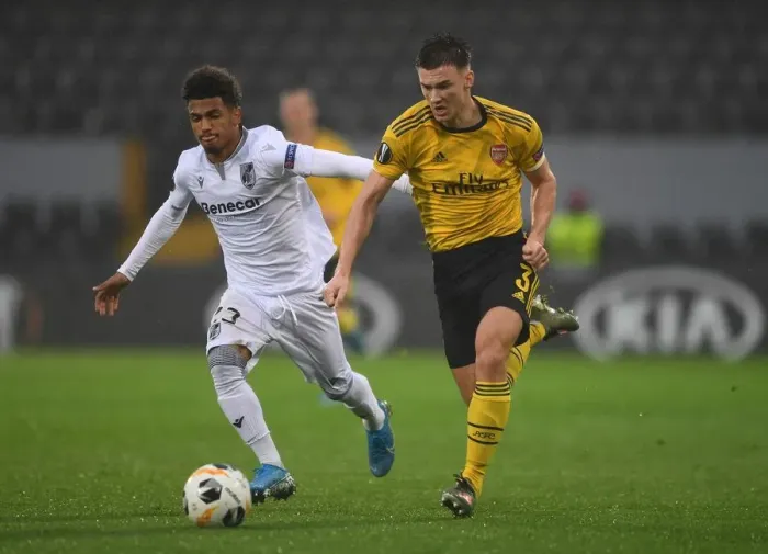 Framed Print : Arsenal's Kieran Tierney Clashes with Marcus Edwards in Europa League Battle