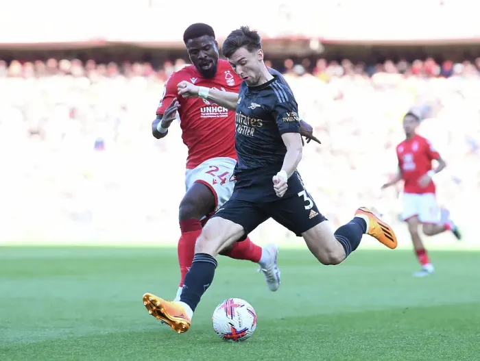 Framed Print : Arsenal's Kieran Tierney Clashes with Nottingham Forest's Serge Aurier in Premier League Showdown