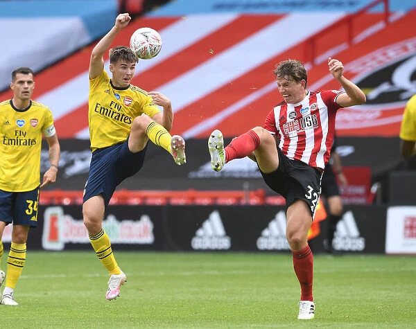 Arsenal's Kieran Tierney Clashes with Sheffield United's Sander Berge in FA Cup Quarterfinal