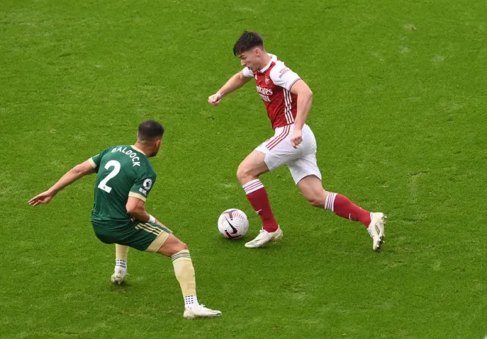 Framed Print : Arsenal's Kieran Tierney Clashes with Sheffield United's George Baldock in Premier League Showdown Framed Print : Arsenal's Kieran Tierney Clashes with Sheffield United's George Baldock in Premier League Showdown