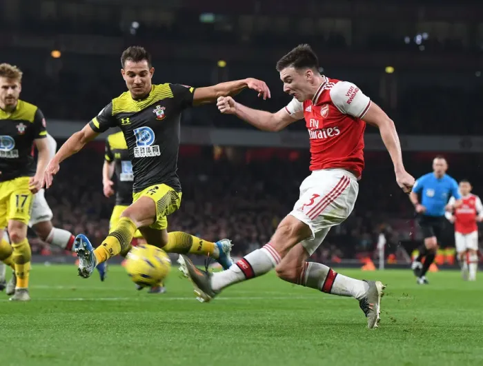 Framed Print : Arsenal's Kieran Tierney Clashes with Southampton's Cedric Soares in Premier League Showdown Framed Print : Arsenal's Kieran Tierney Clashes with Southampton's Cedric Soares in Premier League Showdown