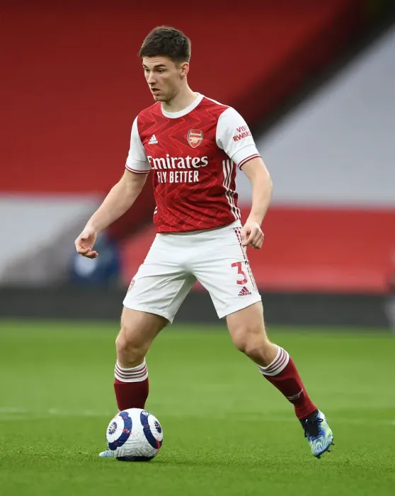 Framed Print : Arsenal's Kieran Tierney Clashes with Tottenham at the Emirates Stadium