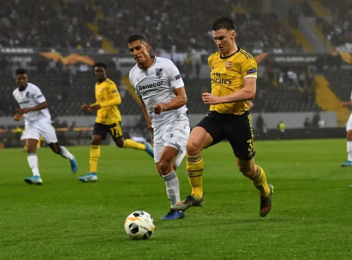Framed Print : Arsenal's Kieran Tierney Clashes with Vitoria Guimaraes Victor Garcia in Europa League Match Framed Print : Arsenal's Kieran Tierney Clashes with Vitoria Guimaraes Victor Garcia in Europa League Match