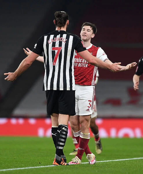 Arsenal's Kieran Tierney Confronts Newcastle's Andy Carroll During FA Cup Clash