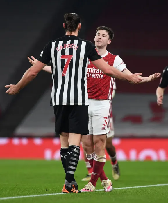 Framed Print : Arsenal's Kieran Tierney Confronts Newcastle's Andy Carroll During FA Cup Clash Framed Print : Arsenal's Kieran Tierney Confronts Newcastle's Andy Carroll During FA Cup Clash