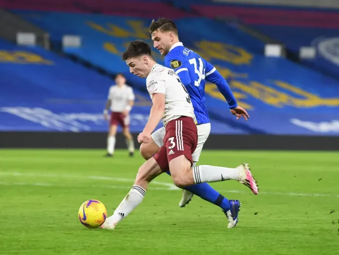 Framed Print : Arsenal's Kieran Tierney Faces Off Against Brighton's Joel Veltman in Empty American Express Community Stadium Framed Print : Arsenal's Kieran Tierney Faces Off Against Brighton's Joel Veltman in Empty American Express Community Stadium