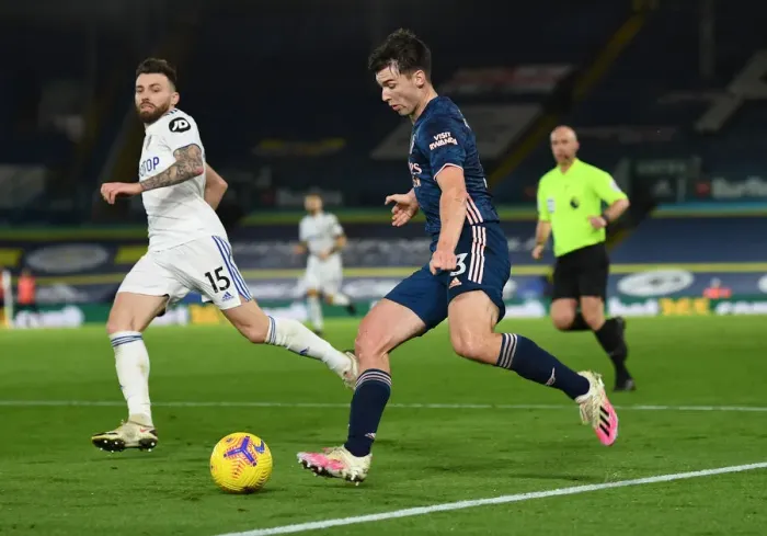 Framed Print : Arsenal's Kieran Tierney Faces Off Against Leeds Stuart Dallas in Premier League Clash