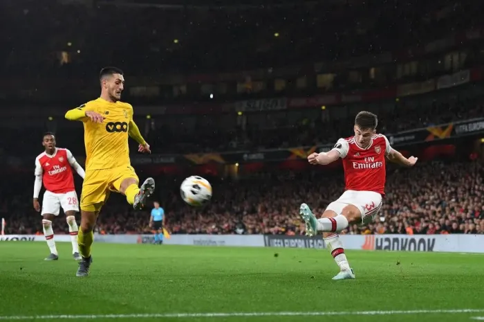 Framed Print : Arsenal's Kieran Tierney Faces Off Against Standard Liege's Aleksandar Beljevic in Europa League Clash Framed Print : Arsenal's Kieran Tierney Faces Off Against Standard Liege's Aleksandar Beljevic in Europa League Clash