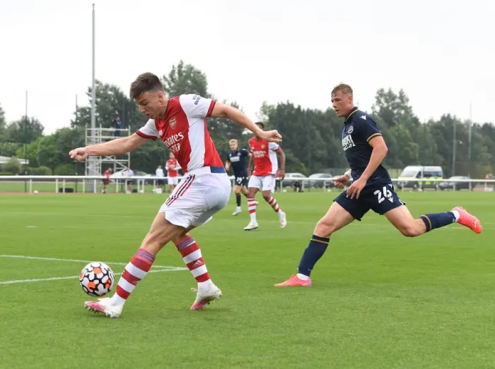 Framed Print : Arsenal's Kieran Tierney Goes Head-to-Head with Millwall's Daniel Ballard in Pre-Season Clash