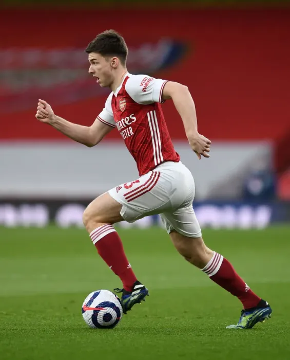 Framed Print : Arsenal's Kieran Tierney Goes Head-to-Head with Tottenham at the Emirates Stadium