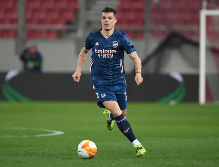 Framed Print : Arsenal's Kieran Tierney in Empty Karaiskakis Stadium: Arsenal vs. Olympiacos in the Europa League Amidst Coronavirus Restrictions