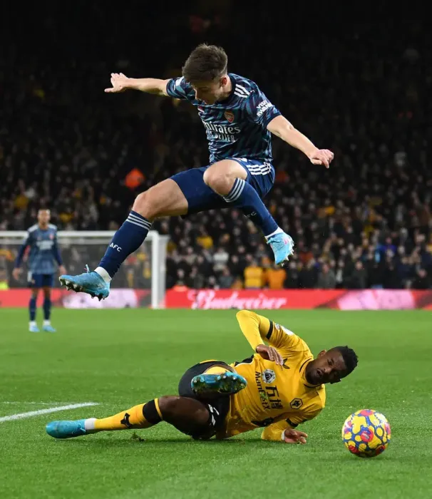 Framed Print : Arsenal's Kieran Tierney Leaps Over Wolves Francisco Trincao in Premier League Clash