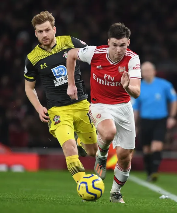 Framed Print : Arsenal's Kieran Tierney Outmaneuvers Southampton's Stuart Armstrong in Premier League Clash