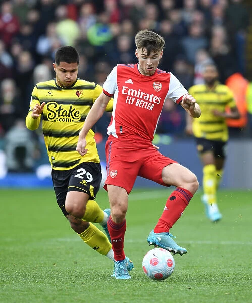 Arsenal's Kieran Tierney Outmaneuvers Watford's Cucho Hernandez in Premier League Clash