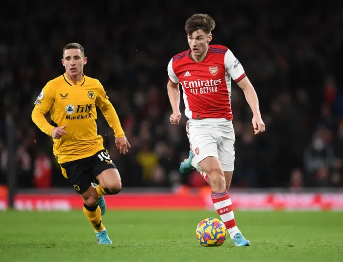 Framed Print : Arsenal's Kieran Tierney Outmaneuvers Wolves Daniel Podence in Premier League Clash