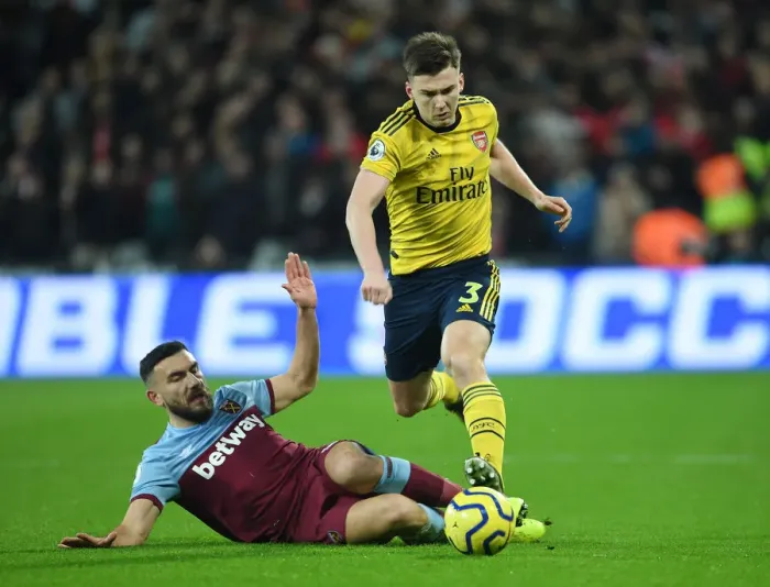 Framed Print : Arsenal's Kieran Tierney Outwits West Ham's Snodgrass: Premier League Battle Framed Print : Arsenal's Kieran Tierney Outwits West Ham's Snodgrass: Premier League Battle