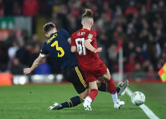 Framed Print : Arsenal's Kieran Tierney Tackles Liverpool's Harvey Elliott in Carabao Cup Clash