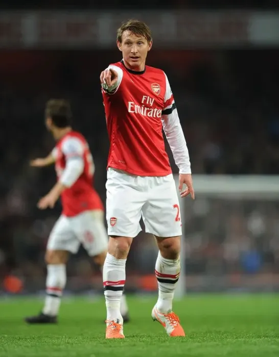 Framed Print : Arsenal's Kim Kallstrom in Action Against Swansea City (2013-14)