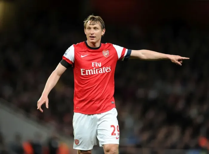 Framed Print : Arsenal's Kim Kallstrom in Action Against West Ham United (2014) Framed Print : Arsenal's Kim Kallstrom in Action Against West Ham United (2014)