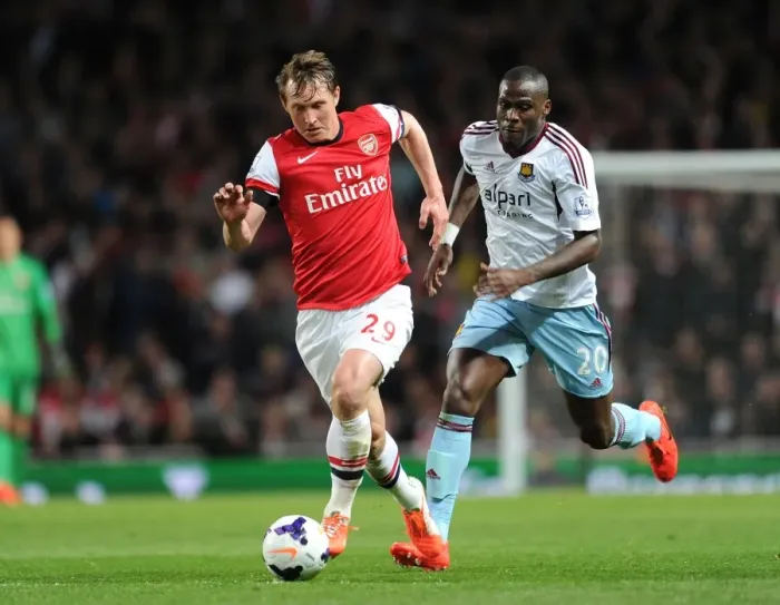 Framed Print : Arsenal's Kim Kallstrom Outmaneuvers West Ham's Guy Demel