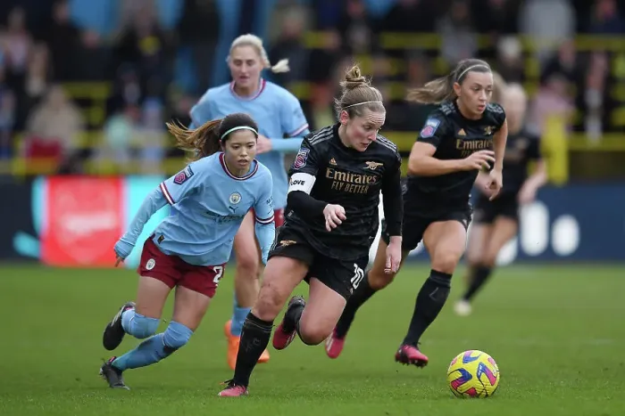 Framed Print : Arsenal's Kim Little Faces Off Against Manchester City's Yui Hasegawa in FA Women's Super League Clash