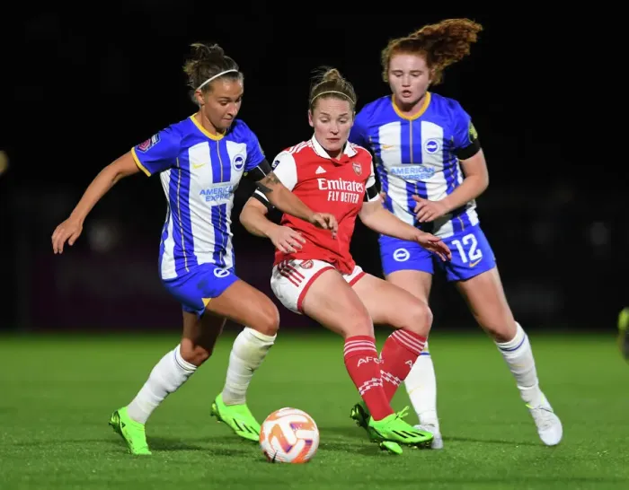 Framed Print : Arsenal's Kim Little Fights Past Defenders in Intense Barclays WSL Showdown Against Brighton Framed Print : Arsenal's Kim Little Fights Past Defenders in Intense Barclays WSL Showdown Against Brighton